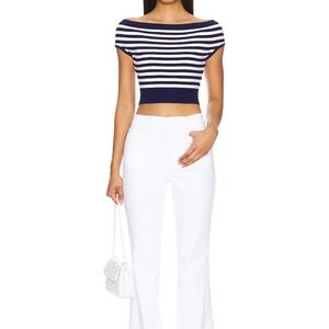 Good American Good Classic Slim Bootcut white jeans.